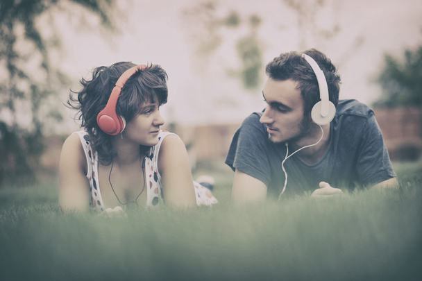 Couple listening to music on headphones - Photo, Image