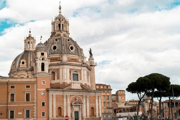 ROME, ITALY - JUNE, 2022: Street scape of the ancient centre of the city. Santa Maria di Loreto, old buildings - Fotó, kép