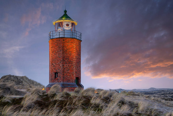 Panoramic image of Kampen lighthouse against evening sky, Sylt, North Frisia, Germany  - Photo, Image