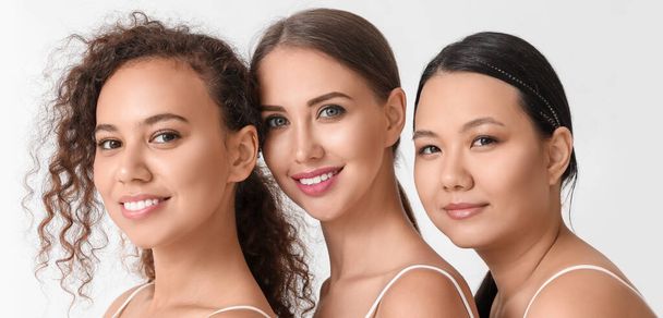 Women of different nationalities on white background. Stop racism - 写真・画像