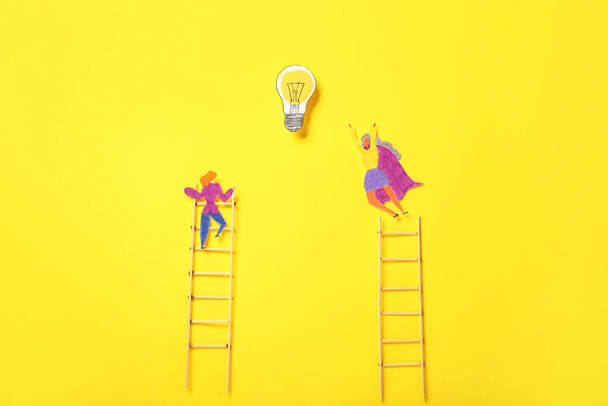 Wooden ladders with human figures and light bulb on yellow background. Concept of progress - Fotó, kép