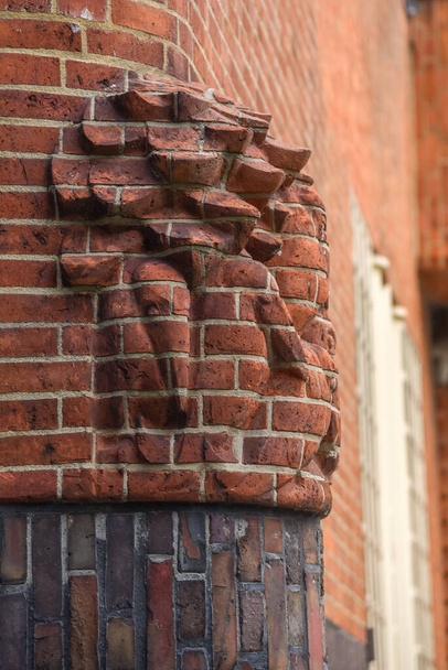 Amsterdam, Netherlands. June 2022. Details of the facades of the characteristic brick building of residential complex with Amsterdam School style architecture. High quality photo. - Foto, Bild