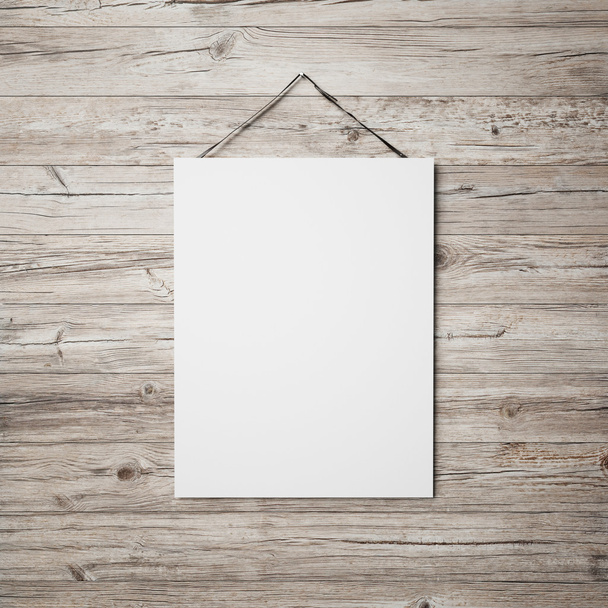 White blank poster hanging on leather belt - Φωτογραφία, εικόνα