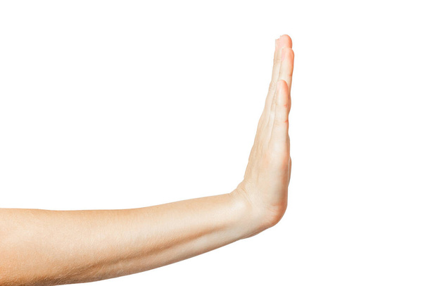 The hand shows a stop gesture. Stop gesture on a white background. High quality photo - Photo, image