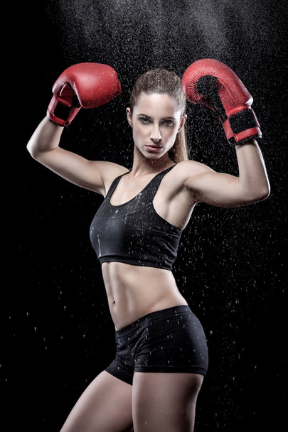 Beautiful woman wearing boxing gloves - Fotó, kép