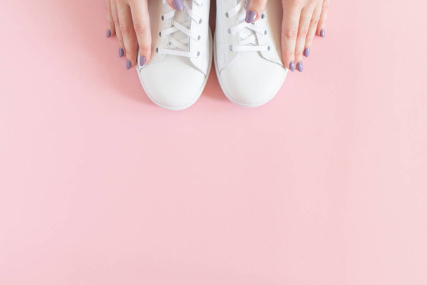 All white sneakers on pink background. Top view,flat lay - Photo, Image