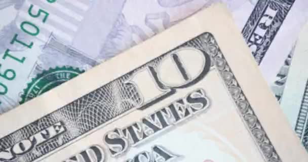 Farklı dünya para birimleri banknotları ve kare kare animasyonlar. Kağıt para dünya para birimi kavramı - Video, Çekim