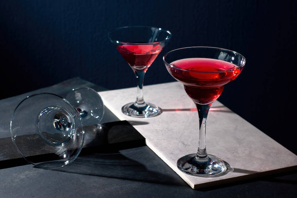 Red cocktail in a margarita glass on a dark background - Photo, Image