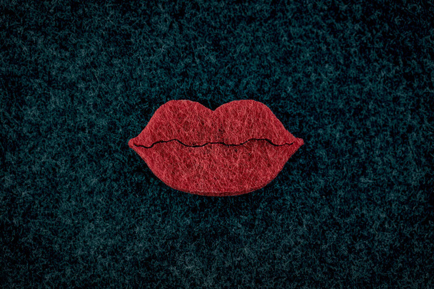 Big red plumpy lips on black background. Beauty concept - Photo, Image