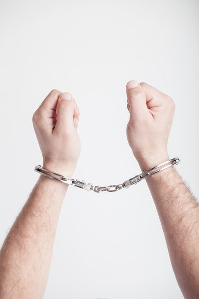 closeup of the hands of a man with handcuffs - Photo, Image