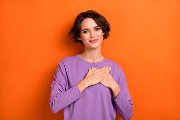 Photo of gorgeous candid person arms palms touch heart look camera isolated on orange color background. - Φωτογραφία, εικόνα