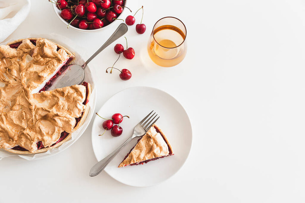 Plate with tasty cherry pie on white background. Top view. Copy space - Фото, изображение