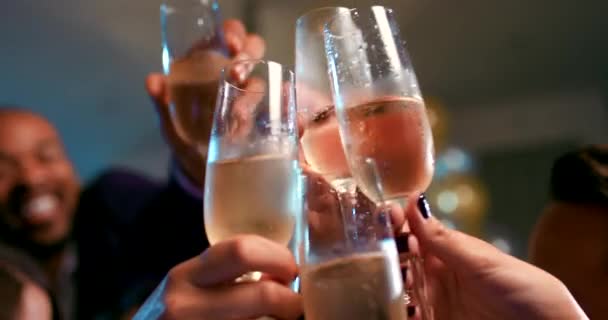 Unrecognizable friend group holding glasses toasting at party. - Video, Çekim