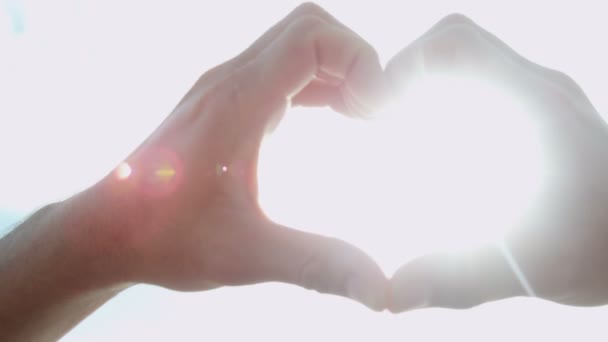 Male hands making heart shape - Footage, Video