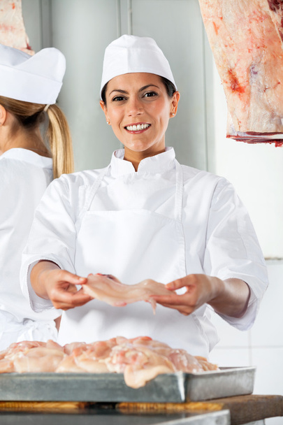 Confident Butcher Offering Raw Meat - Photo, image