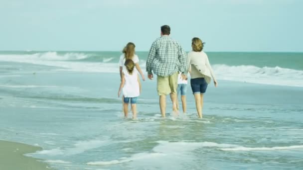Parents with daughters walking on beach - Footage, Video