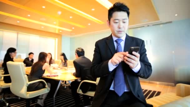 Азіатський бізнесмен на фінансові зустрічі - Кадри, відео