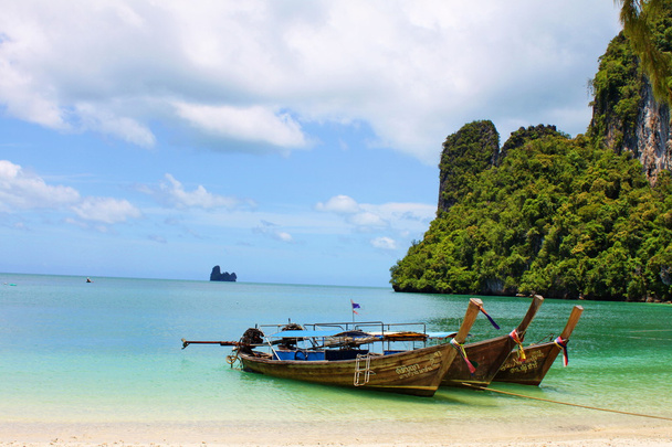 Long tailboats by the shore at Hong Island, Krabi Thailand against beautifu - Photo, Image