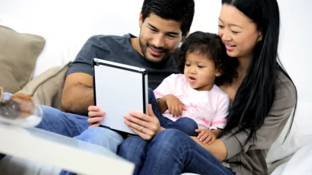 Parents with daughter using tablet - Footage, Video