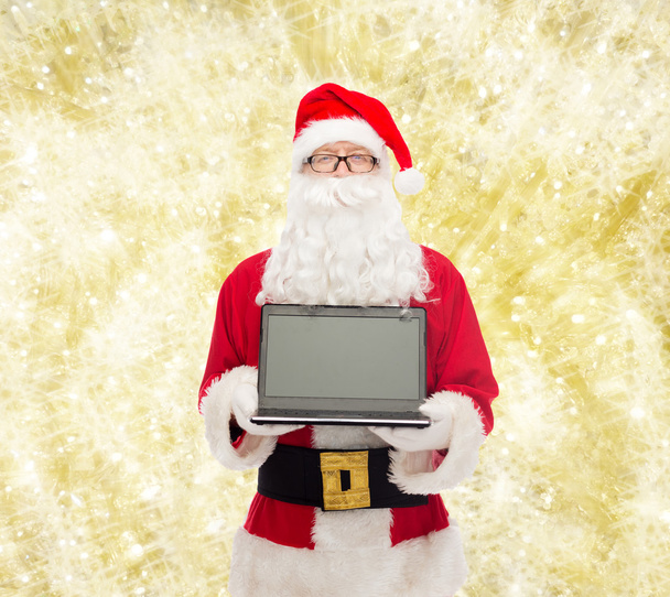 man in costume of santa claus with laptop - Fotografie, Obrázek