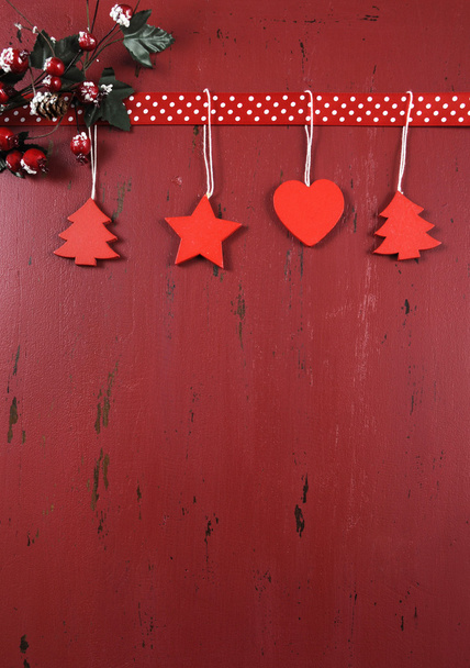 Christmas background with vintage style ornaments on dark red recycled wood. - Photo, Image