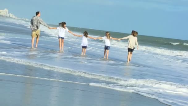 Parents with daughters on beach - Footage, Video