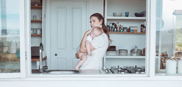 Shot of a beautiful young mother bonding with her newborn at home. - Foto, immagini