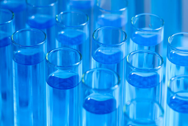 Test tubes with light blue reagents, closeup. Laboratory analysis - Foto, Imagen