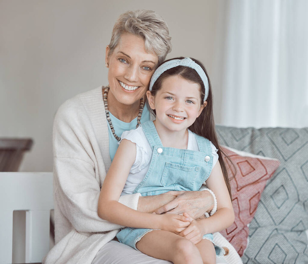 Shot of a mature woman bonding with her granddaughter at home. - Photo, Image