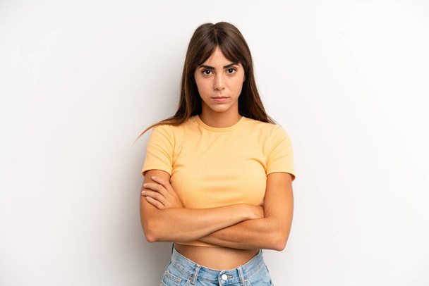 hispanic pretty woman feeling displeased and disappointed, looking serious, annoyed and angry with crossed arms - Foto, imagen