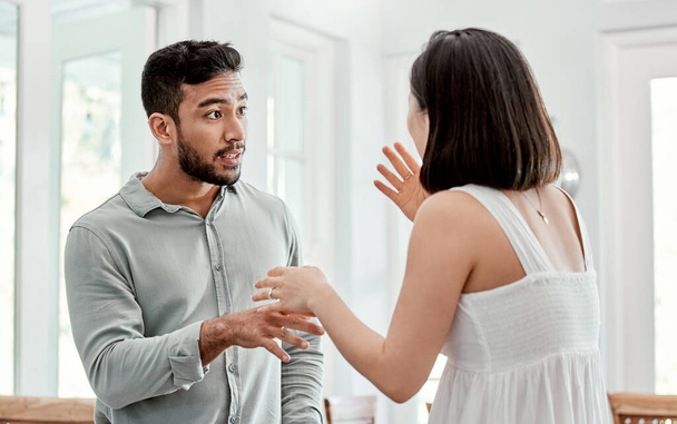 Shot of a young couple having an argument at home. - Photo, image