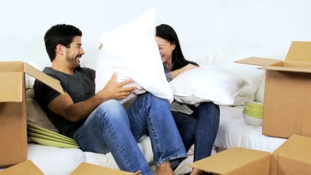 Couple fooling around with cushions - Footage, Video