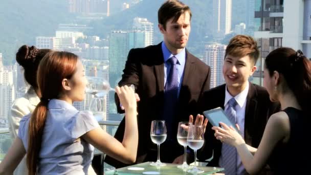 Business people in rooftop restaurant - Footage, Video