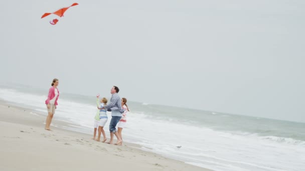 Family with flying kite on beach - Footage, Video