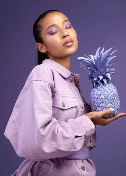 Studio shot of a beautiful young woman modelling a purple colour concept. - Foto, afbeelding