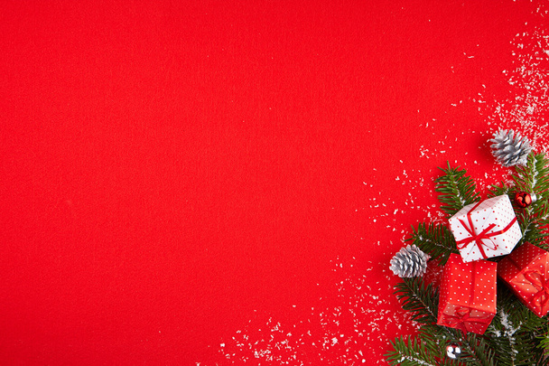 Red background with gifts and Christmas tree - Photo, Image