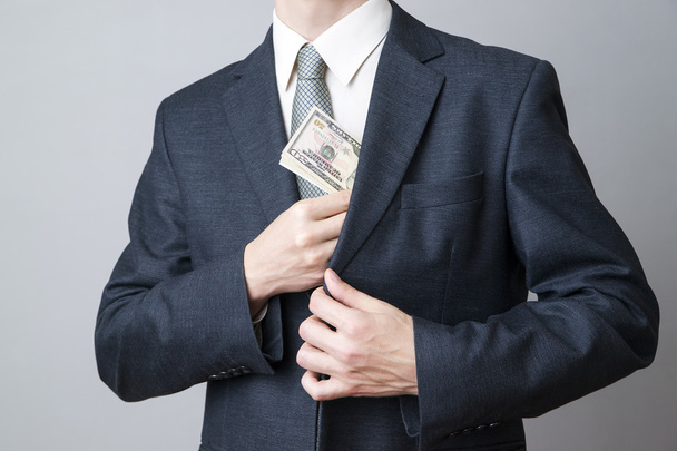 Businessman with money in studio - Zdjęcie, obraz