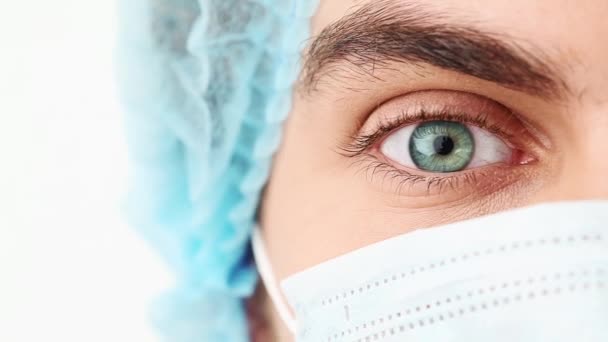 Doctor portrait of eye opening. Eye surgery patient looking - Video, Çekim