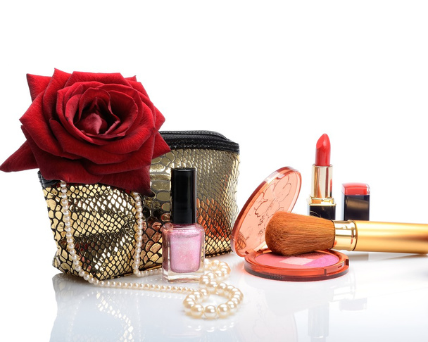 Cosmetic bag, makeup items, perfume and flowers in still life - Photo, Image