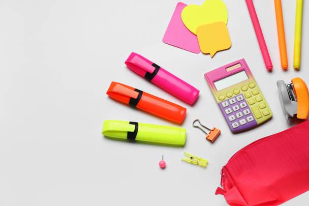 Pencil case and different stationery on white background - Foto, Imagen