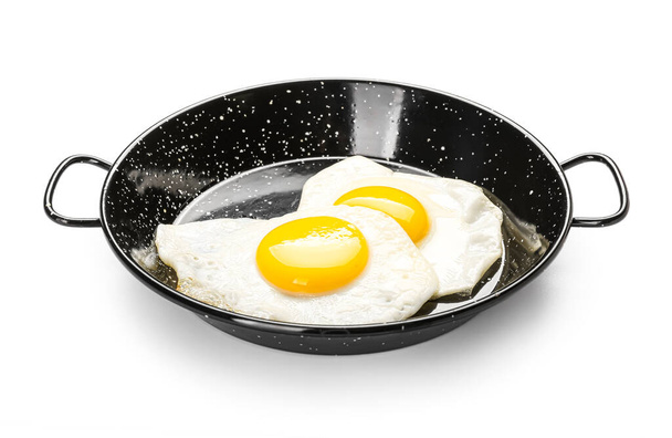 Frying pan with eggs isolated on white background - Фото, зображення