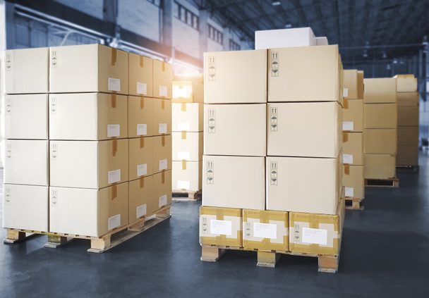 Packaging Boxes Stacked on Pallets in Storage Warehouse. Cardboard Boxes Supply Chain. Storehouse Commerce Shipment Distribution. Shipping Warehouse Logistics. - Photo, Image