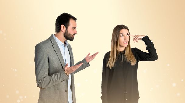 Businesswoman making a crazy gesture over gloss background  - Photo, Image