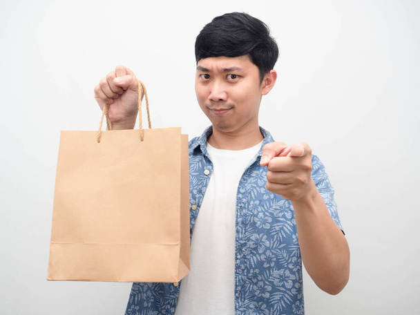 Man holding shopping bag point finger at you - Фото, изображение