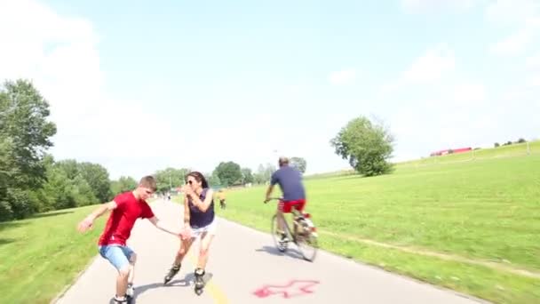 Happy young couple rollerblading - Footage, Video