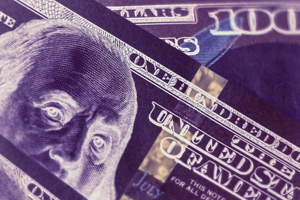 Close up Franklin's face on a one hundred dollar. American, US Dollars Cash Money in negative. Background pattern for design.	 - 写真・画像