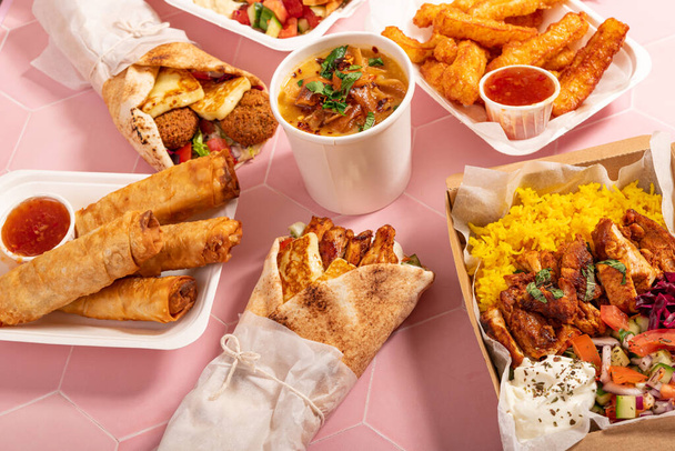 Variety of traditional takeaway Mediterranean Arabic meals for sharing - Foto, Imagem