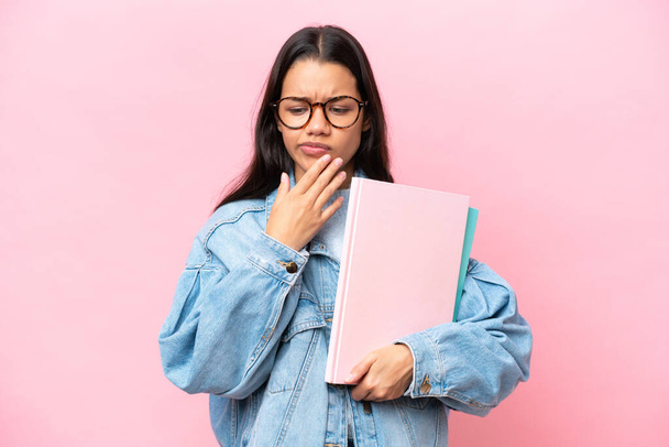 Young student Colombian woman isolated on pink background thinking - Φωτογραφία, εικόνα