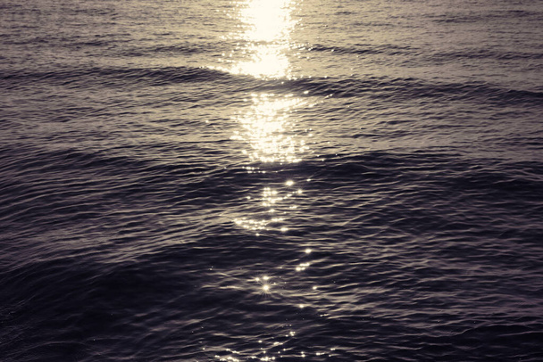 Rippled surface of sea at sunset as background - Valokuva, kuva