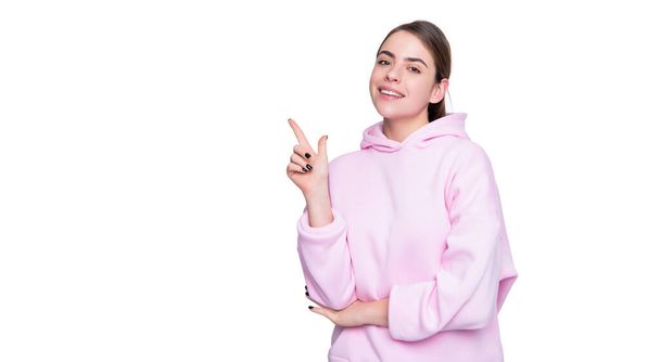 positive young girl in pink hoodie isolated on white background. - Foto, immagini